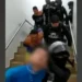 Policía Ecuador Police leading men out of a hospital after their arrest.