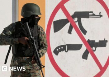 People flee their homes holding their belongings to escape gang violence, as Haiti continues in a state of emergency, in Port-au-Prince, Haiti March 6, 2024.