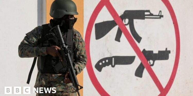 People flee their homes holding their belongings to escape gang violence, as Haiti continues in a state of emergency, in Port-au-Prince, Haiti March 6, 2024.