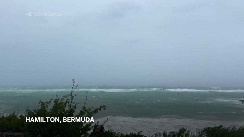 Hurricane Ernesto charges toward Bermuda with tropical storm conditions already battering the island