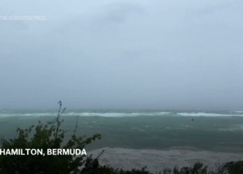 Hurricane Ernesto charges toward Bermuda with tropical storm conditions already battering the island
