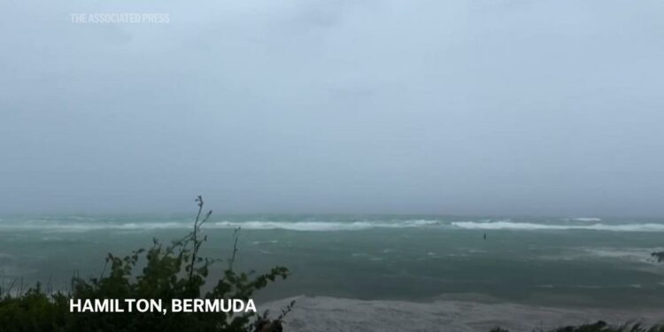 Hurricane Ernesto charges toward Bermuda with tropical storm conditions already battering the island