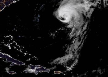 Hurricane Ernesto makes landfall in Bermuda and could cause flash flooding, storm surge