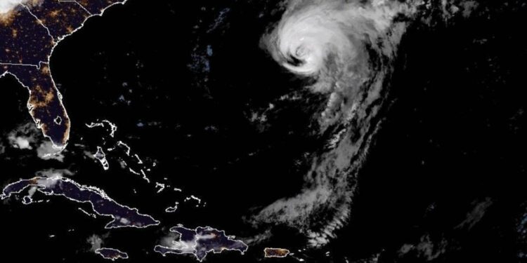 Hurricane Ernesto makes landfall in Bermuda and could cause flash flooding, storm surge