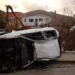Paul Blake/BBC Debris and an overturned car on British Virgin islands