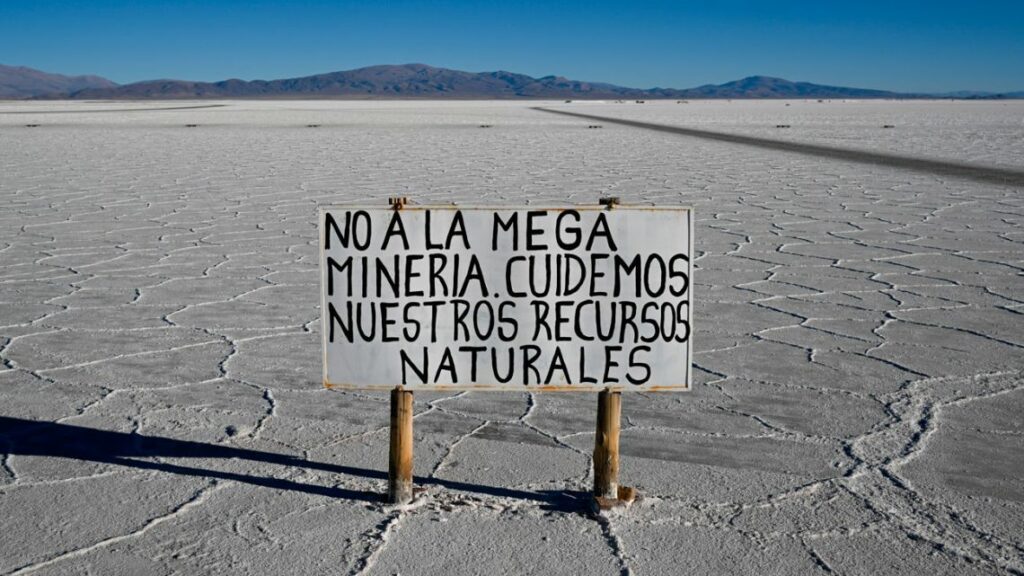 A sign reading: 'No to mega-mining. Let's take care of natural resources,' is seen at Salinas Grandes salt flat, Jujuy province, Argentina on July 2, 2024.