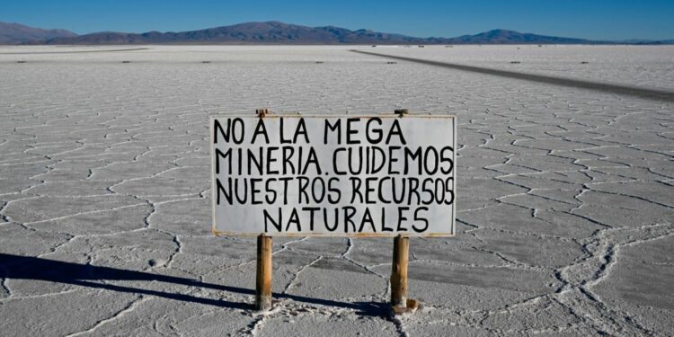 A sign reading: 'No to mega-mining. Let's take care of natural resources,' is seen at Salinas Grandes salt flat, Jujuy province, Argentina on July 2, 2024.