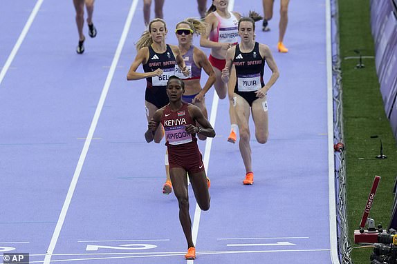 Faith Kipyegon, of Kenya, wins her women's 1500-meters semifinal at the 2024 Summer Olympics, Thursday, Aug. 8, 2024, in Saint-Denis, France. (AP Photo/Martin Meissner)