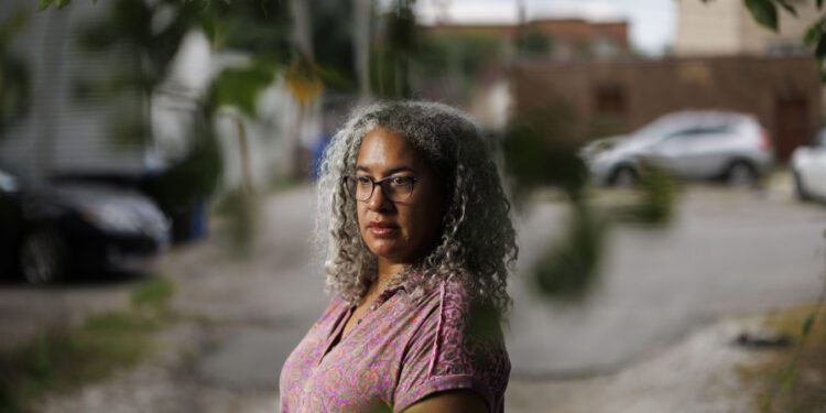 Jennifer Leigh Husbands, 51, is shown near her home Aug. 1 in Chicago. Husbands is Caribbean American; her mother is from Michigan and her father is from Barbados. (Armando L.