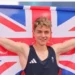 Getty Images Toby Roberts holding union flag after winning Olympic gold