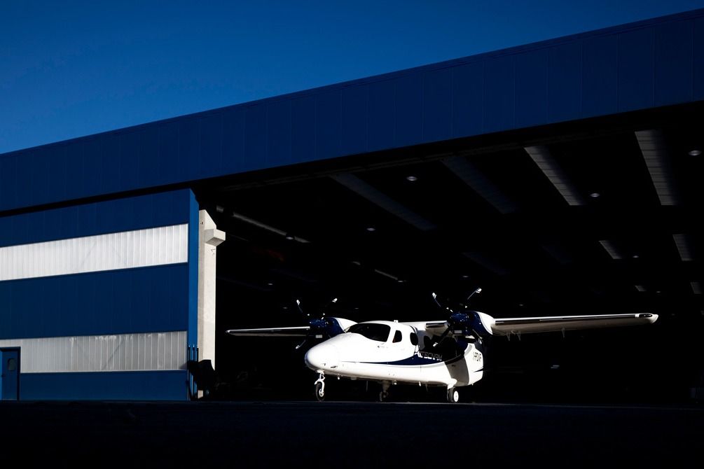 A Tecnam P2012 Traveller parked at an airfield