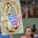 A woman holds an image of Our Lady of Guadalupe with the words Free Venezuela during a vigil called by the opposition demanding freedom for political prisoners arrested during protest following the contested re-election of Venezuelan President Nicolas Maduro in Caracas, August 8, 2024.