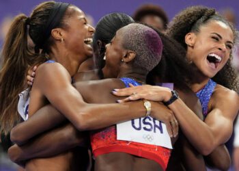 Women's 4x400 meter runners for Team USA celebrate gold at Paris Olympics...