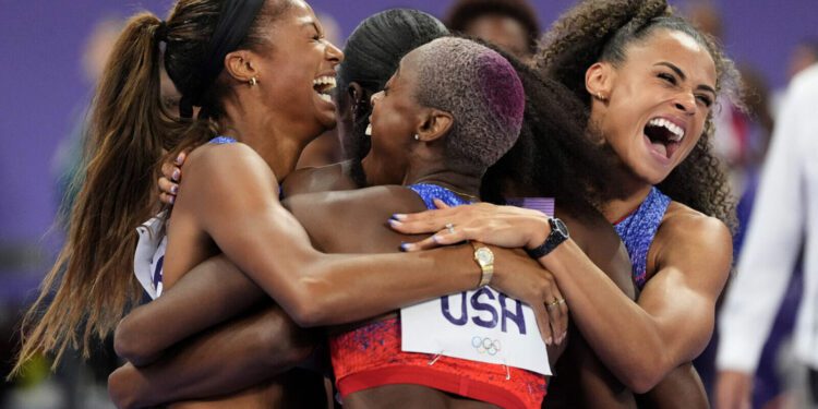 Women's 4x400 meter runners for Team USA celebrate gold at Paris Olympics...