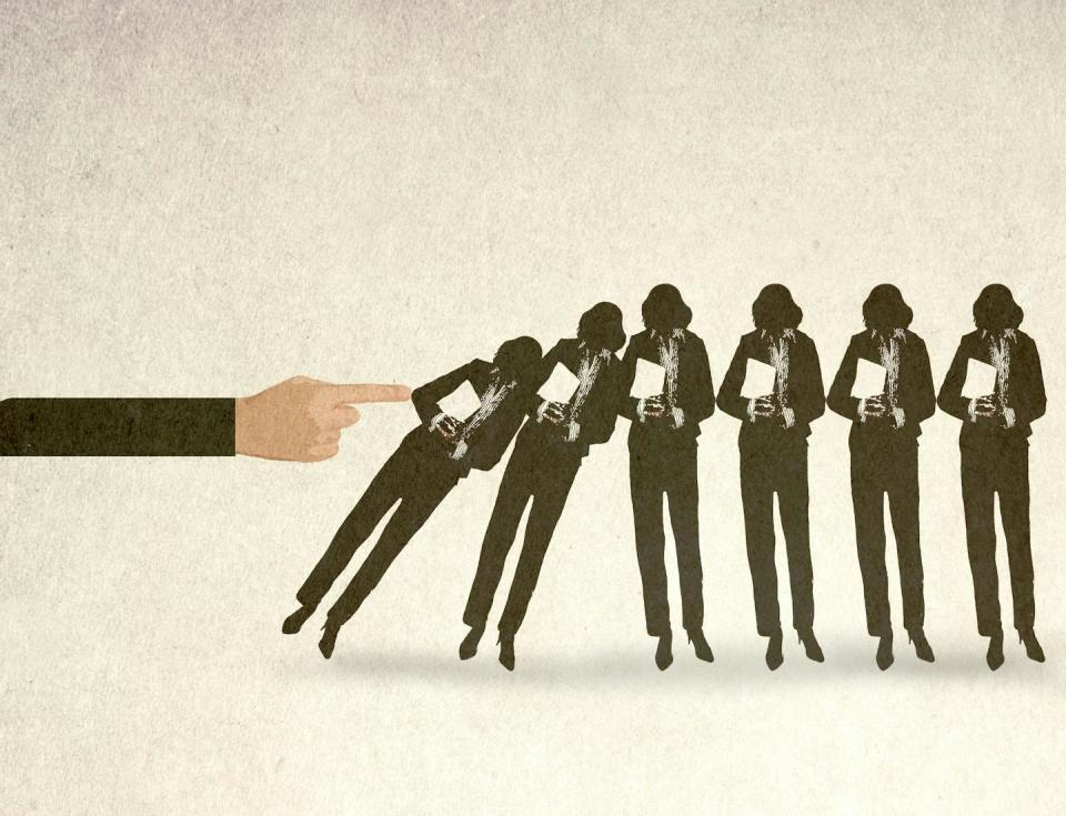 An Illustration of an oversized hand toppling a line of businesswomen.