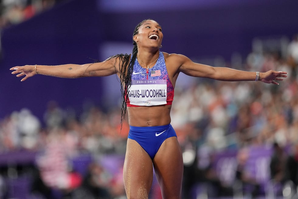 Tara Davis-Woodhall, of the United States, celebrates after competing in the women's long jump...