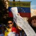 A protester chants slogans while holding the electoral records during a demonstration as Venezuelan citizens have gathered in the streets of Pamplona, to raise their voices against the electoral fraud that occurred in the elections held on July 28 in Venezuela.