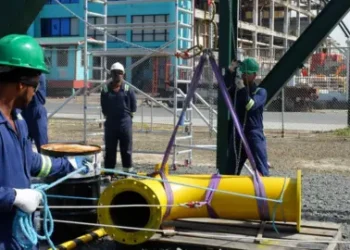 BBC Oil industry workers installing equipment in Guyana