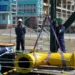 BBC Oil industry workers installing equipment in Guyana