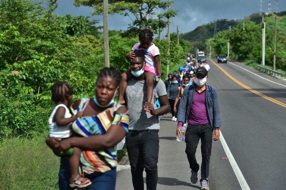 Migrants from Ghana, Ivory Coast and DR Congo walk along the Pan-American in Honduras in June 2020. They are on their way to Mexico and ultimately the US. 