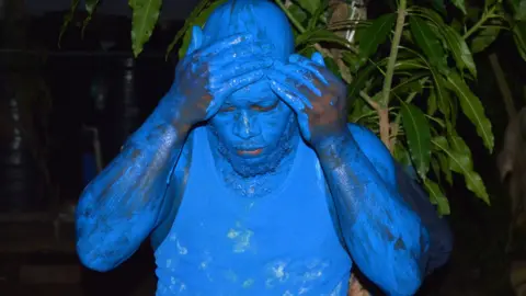 Anselm Gibbs Samuel Thomas prepares to portray a blue devil