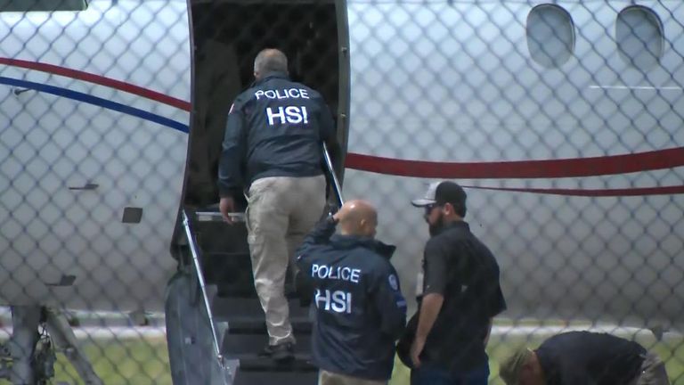 US officials board the plane. Pic: Enex