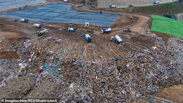 China, once the world's largest producer of plastic waste, is now the fourth biggest polluter and creates 2.8 million tonnes each year thanks to improving management systems. Pictured: Workers sort waste at a landfill in Xi'an, China