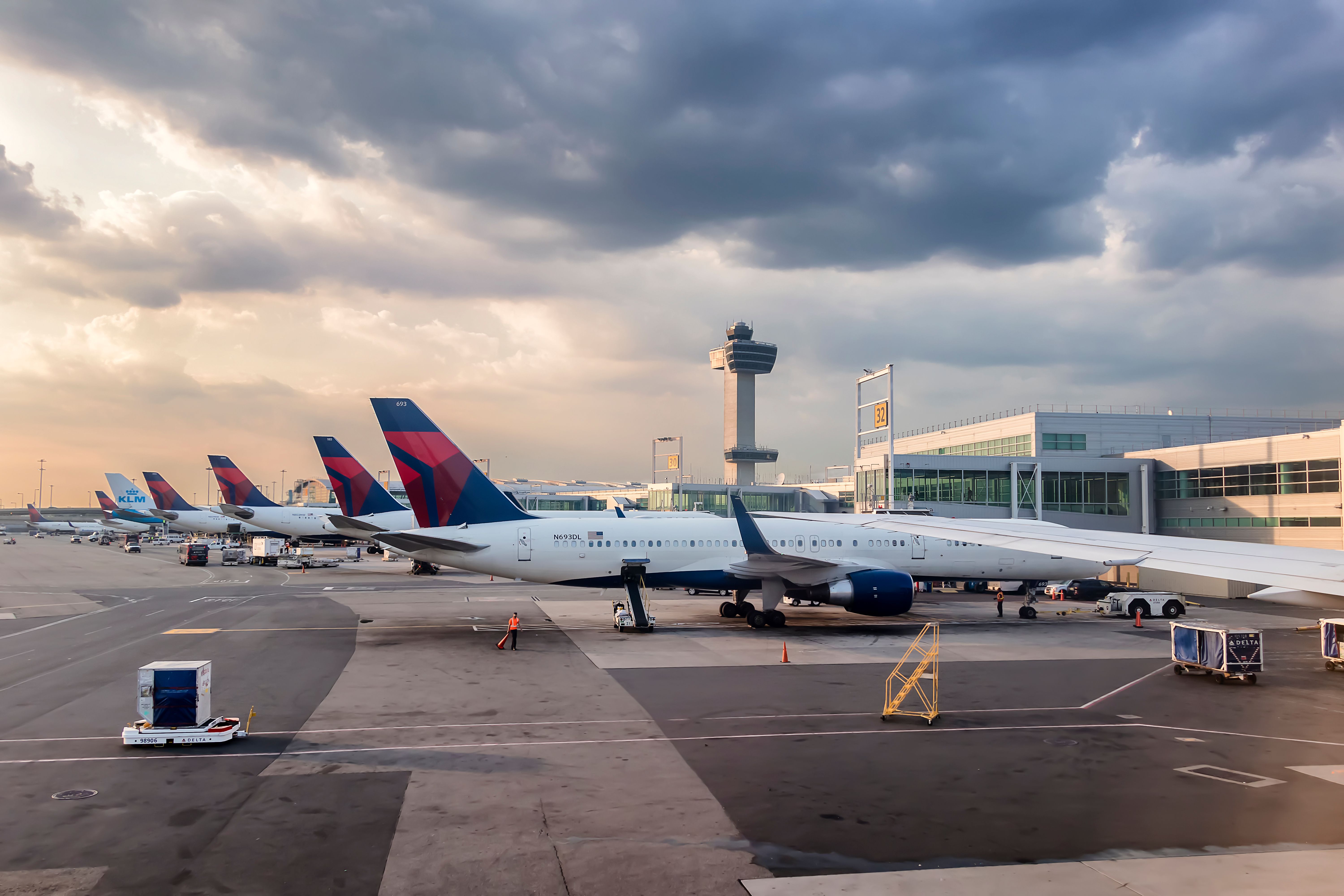 Delta Air Lines aircraft parked at the gates at New York John F. Kennedy International Airport JFK shutterstock_1017102973