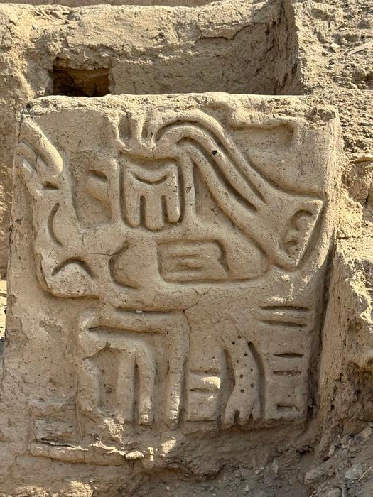 Carving of mythological bird creature at temple site in Cerro Las Animas