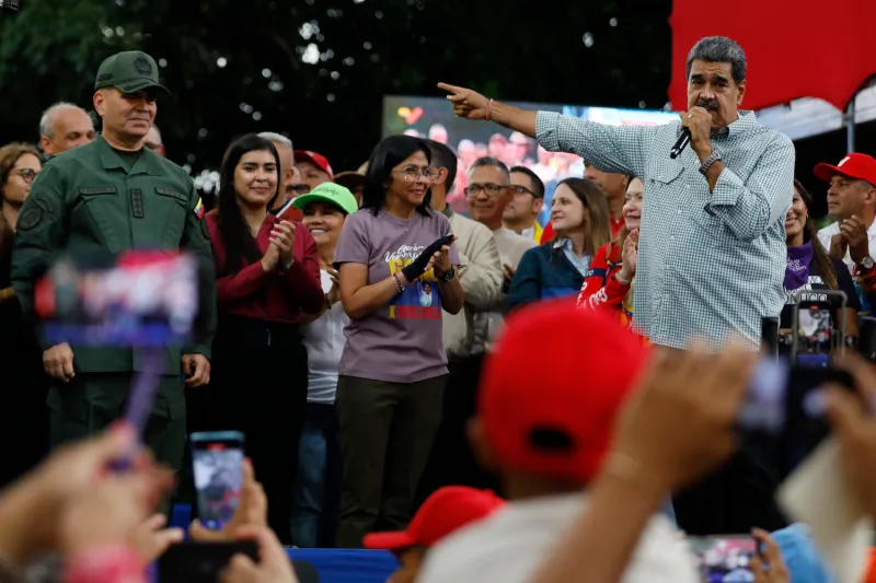 Venezuelan President Nicolás Maduro delivers a speech next to Defense Minister Vladimir Padrino López and Vice President Delcy Rodríguez during a rally in Caracas on Aug. 28.