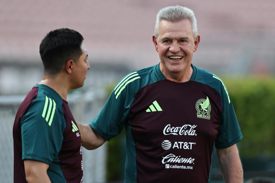 Mexico coach Javier Aguirre, right, watches players work out during a training session in September.