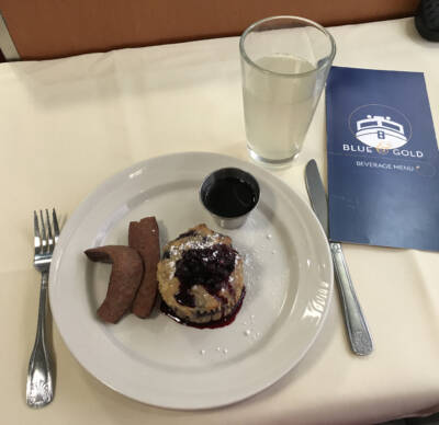 A dining car meal of Alaskan sausage and blueberry bread pudding. Alaska by Rail adventure.