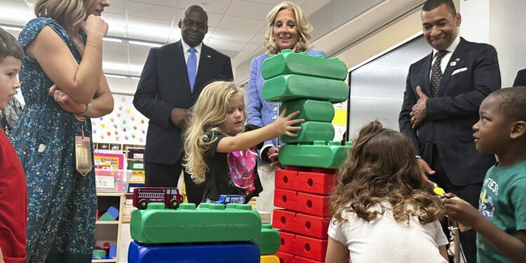 Jill Biden and Lloyd Austin visit an Alabama base to tout expanded military benefits