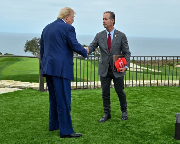 Former President Donald Trump and John Cruikshank, mayor of Rancho...