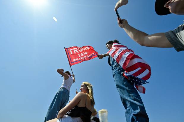 Hundreds of Donald Trump supporters line Trump National Road as...