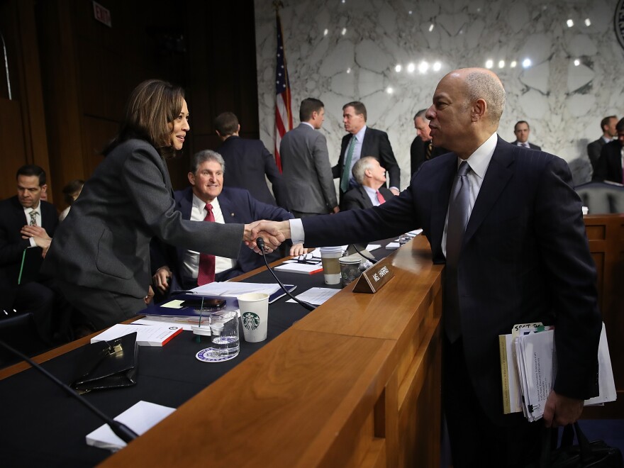 Former Homeland Security Secretary Jeh Johnson greets Sen. Kamala Harris, D-Calif.,  at a hearing of the Senate Intelligence Committee on March 21, 2018.