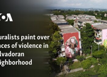 Muralists paint over traces of violence in Salvadoran neighborhood