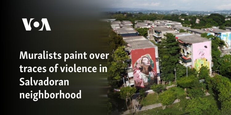 Muralists paint over traces of violence in Salvadoran neighborhood