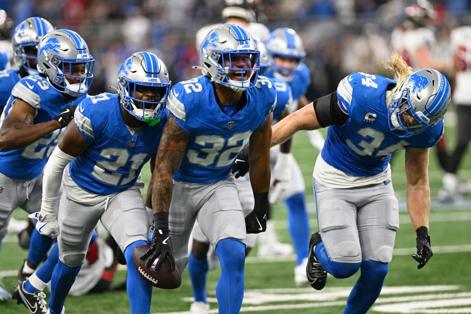 Sep 15, 2024; Detroit, Michigan, USA; Detroit Lions safety Brian Branch (32) celebrates after intercepting a pass from Tampa Bay Buccaneers quarterback Baker Mayfield (not pictured) in the second quarter at Ford Field. Mandatory Credit: Lon Horwedel-Imagn Images