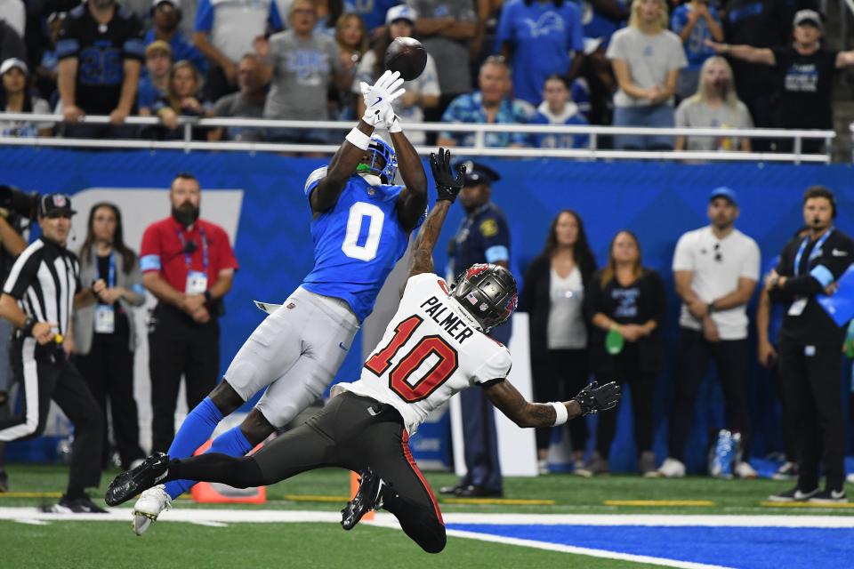 Sep 15, 2024; Detroit, Michigan, USA; Detroit Lions cornerback Terrion Arnold (0) breaks up a pass intended for Tampa Bay Buccaneers wide receiver Trey Palmer (10) in the first quarter at Ford Field. Mandatory Credit: Eamon Horwedel-Imagn Images