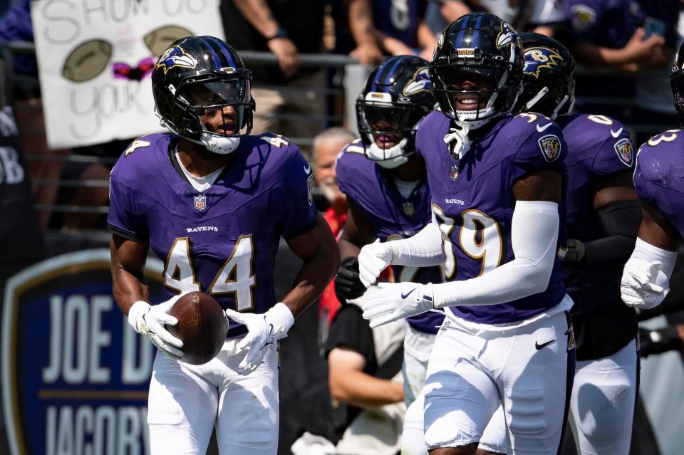 Sep 15, 2024; Baltimore, Maryland, USA; Baltimore Ravens cornerback Marlon Humphrey (44) celebrates with teammates zaftret intercepting as Las Vegas Raiders quarterback Gardner Minshew (not pictured) pass during the first half at M&T Bank Stadium. Mandatory Credit: Tommy Gilligan-Imagn Images