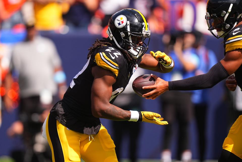 Sep 15, 2024; Denver, Colorado, USA; Pittsburgh Steelers quarterback Justin Fields (2) hands off to running back Najee Harris (22) in the first quarter against the Denver Broncos at Empower Field at Mile High. Mandatory Credit: Ron Chenoy-Imagn Images