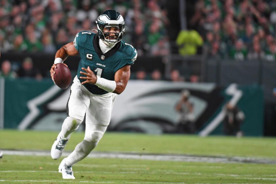 Sep 16, 2024; Philadelphia, Pennsylvania, USA; Philadelphia Eagles quarterback Jalen Hurts (1) carries the ball against the Atlanta Falcons during the second quarter at Lincoln Financial Field. Mandatory Credit: Eric Hartline-Imagn Images