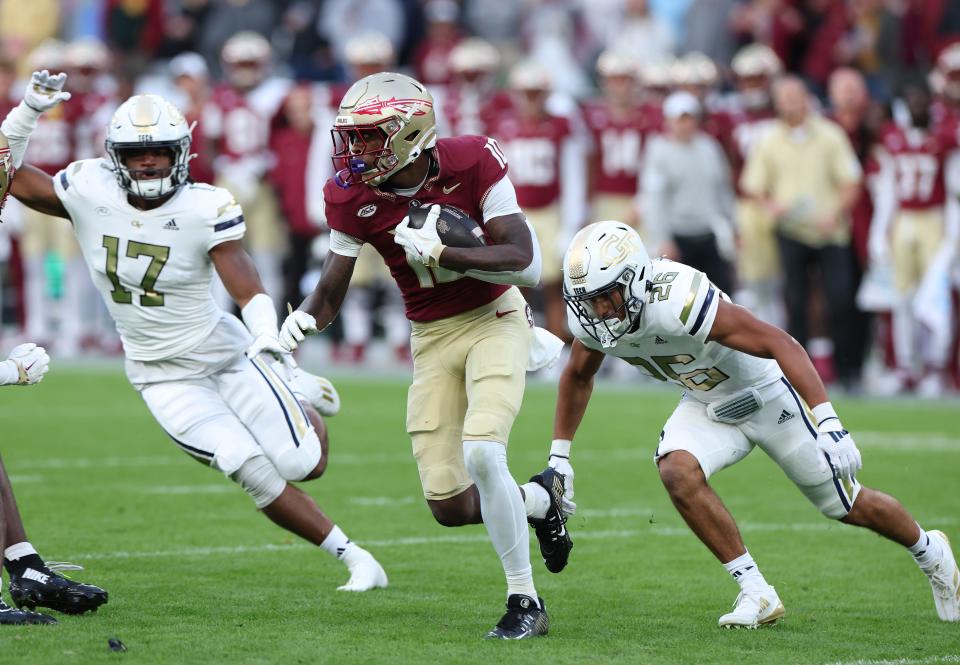 DUBLIN, IRELAND - AUGUST 24: Malik Benson of the Florida State Seminoles evades Ben Hollerbach of the Georgia Tech Yellow Jackets during the Aer Lingus College Football Classic game at Aviva Stadium on August 24, 2024 in Dublin, Ireland. (Photo by Charles McQuillan/Getty Images)