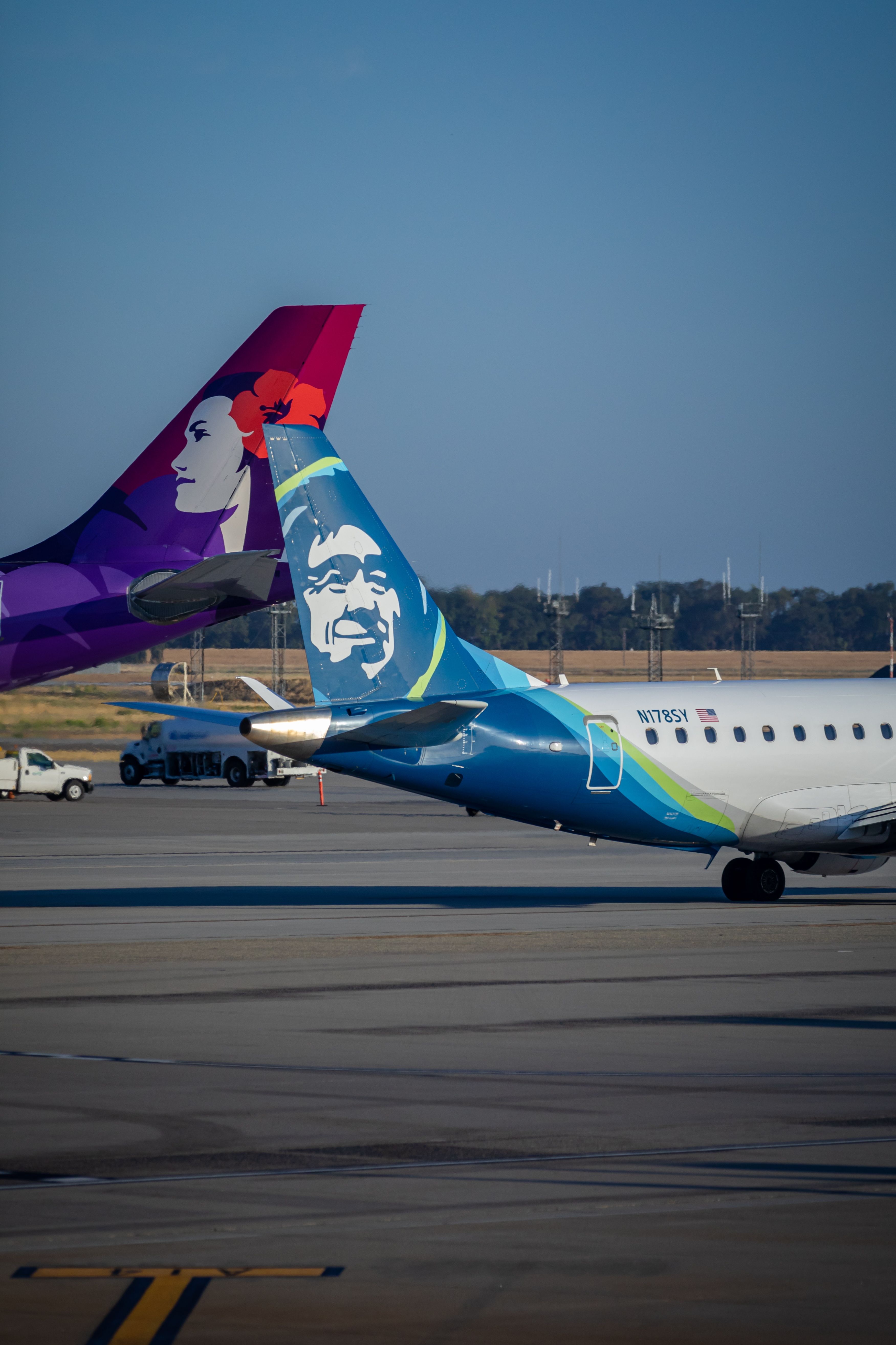 Alaska Airlines and Hawaiian Airlines aircraft in Sacramento shutterstock_2121442103