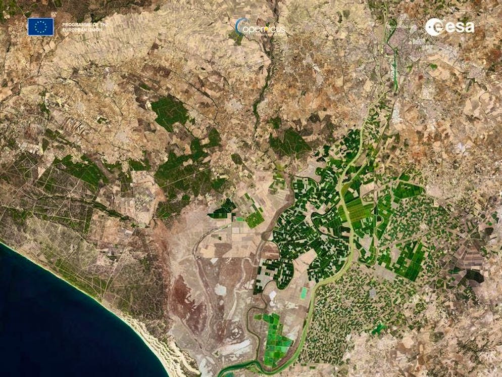 Satellite. One of the satellite's images offers a clear view of Seville and the surrounding area in southern Spain. Seville, the capital of Andalusia, is located on the Guadalquivir River, one of the longest rivers in Spain