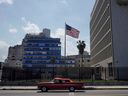 A vintage car passes by the U.S. Embassy in Havana in 2021.