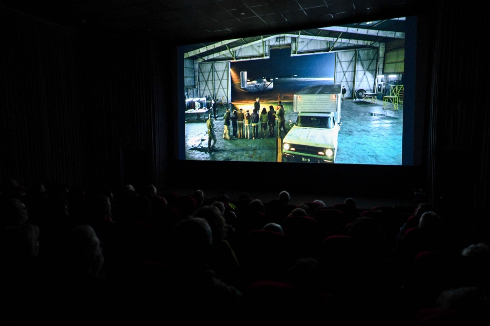 People watch the film ‘Traslados’ directed by Argentine Nicolas Gil Lavedra in Buenos Aires on September 17, 2024. — AFP pic