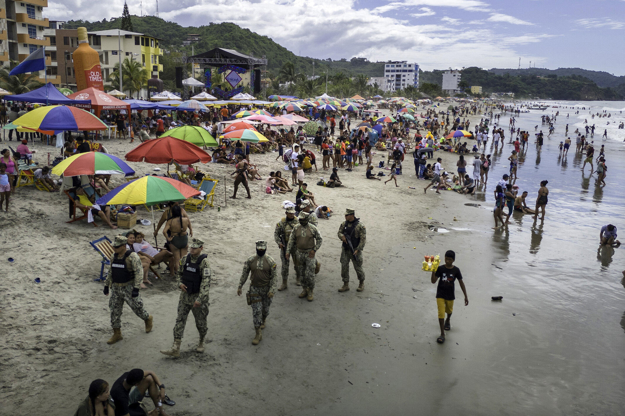 Soldiers patrolling a beach where locals and tourists are celebrating the Carnival weekend.  Atacames, Ecuador on 11 February, 2024.