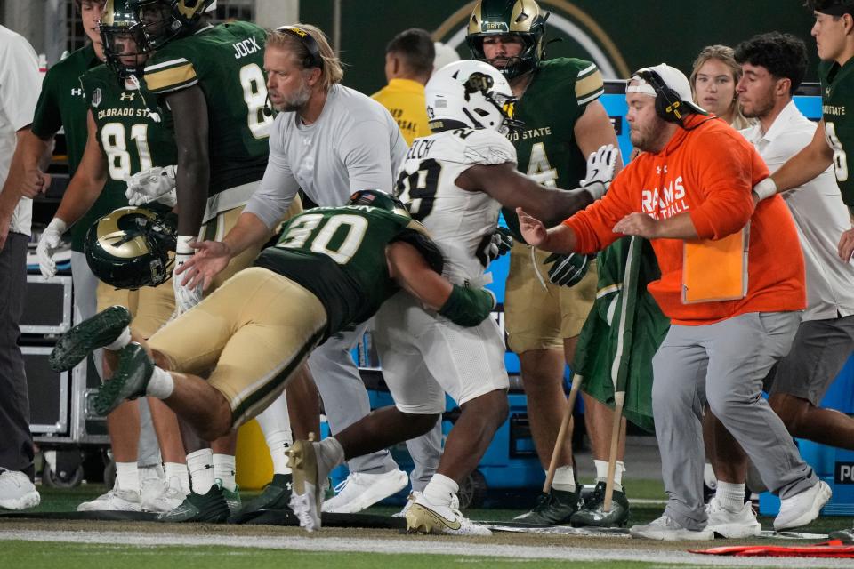 Sep 14, 2024; Fort Collins, Colorado, USA; Colorado State Rams linebacker Chase Wilson (30) is charged with a penalty on this play late in the game at Sonny Lubick Field at Canvas Stadium. Mandatory Credit: Michael Madrid-Imagn Images